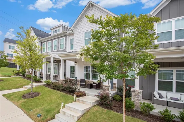 a front view of a house with garden