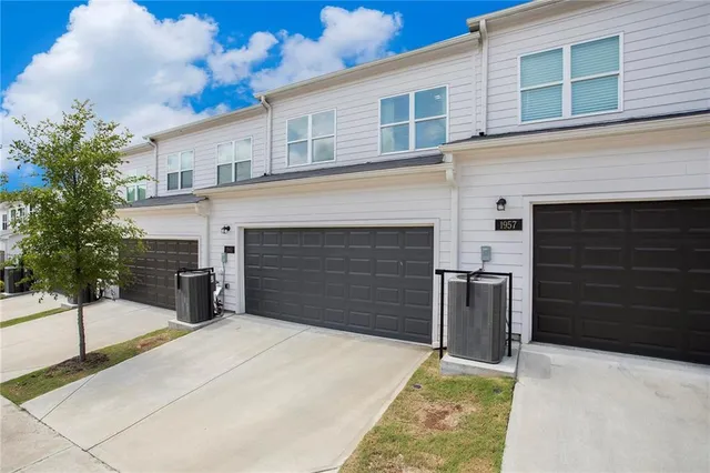 a front view of a house with yard