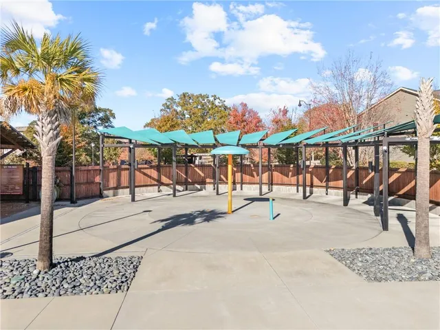 a view of a swimming pool and an outdoor seating