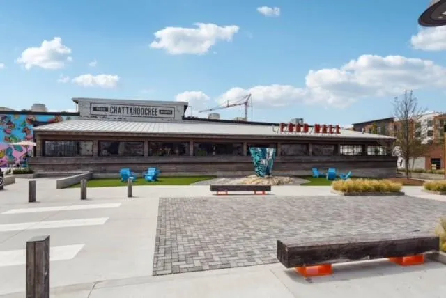a view of a patio with table and chairs potted plants