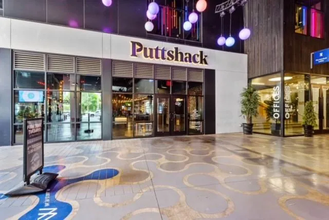 a view of a park with large trees