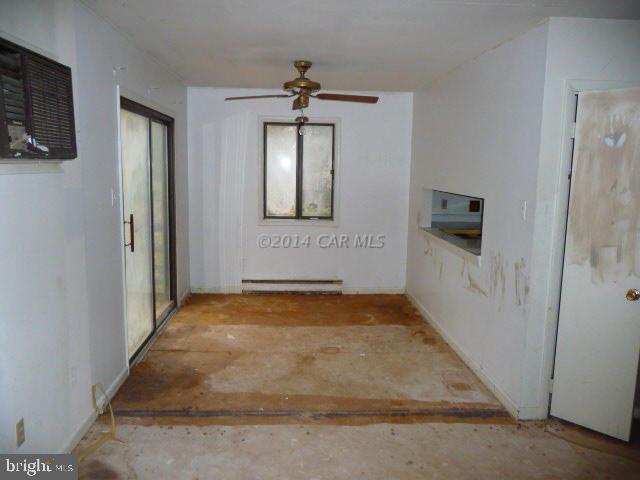 213 Windjammer Road Berlin, MD 21811 - Photo 5 of 10 a view of a livingroom with wooden floor and a flat screen tv