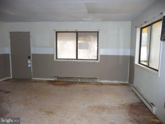 213 Windjammer Road Berlin, MD 21811 - Photo 6 of 10 an empty room with windows