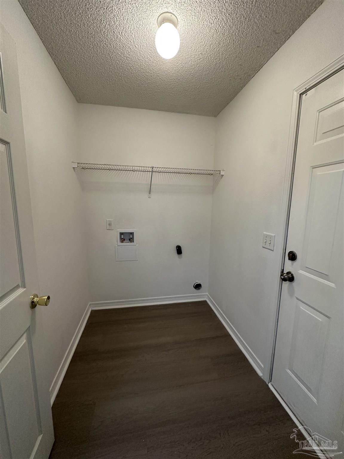 7959 Cayenne Way Pensacola, FL 32526 - Photo 17 of 19 a view of a room with racks on the wall
