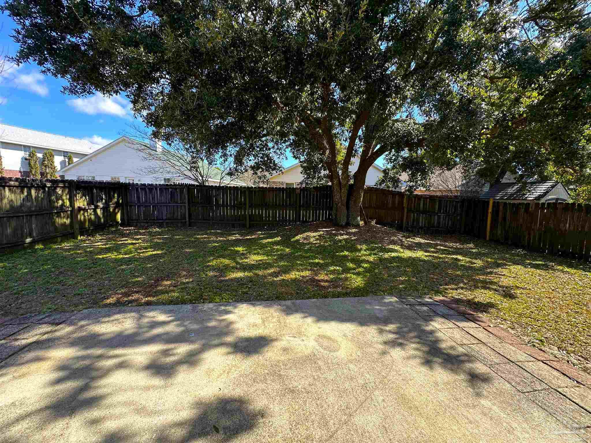 7959 Cayenne Way Pensacola, FL 32526 - Photo 18 of 19 a view of a backyard with a small cabin