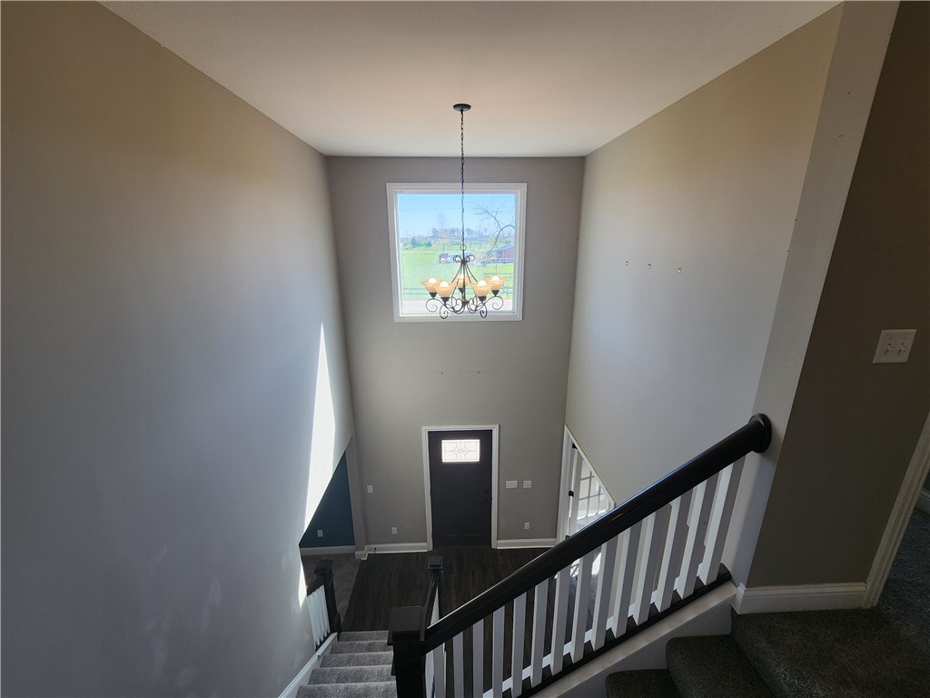 7441 Dodson Road Brookville, OH 45309 - Photo 17 of 50 This spacious foyer features a soaring ceiling and an inviting staircase leading to the upper level.