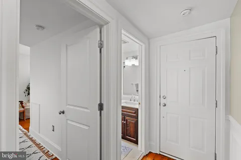 a view of a bathroom with a sink and mirror