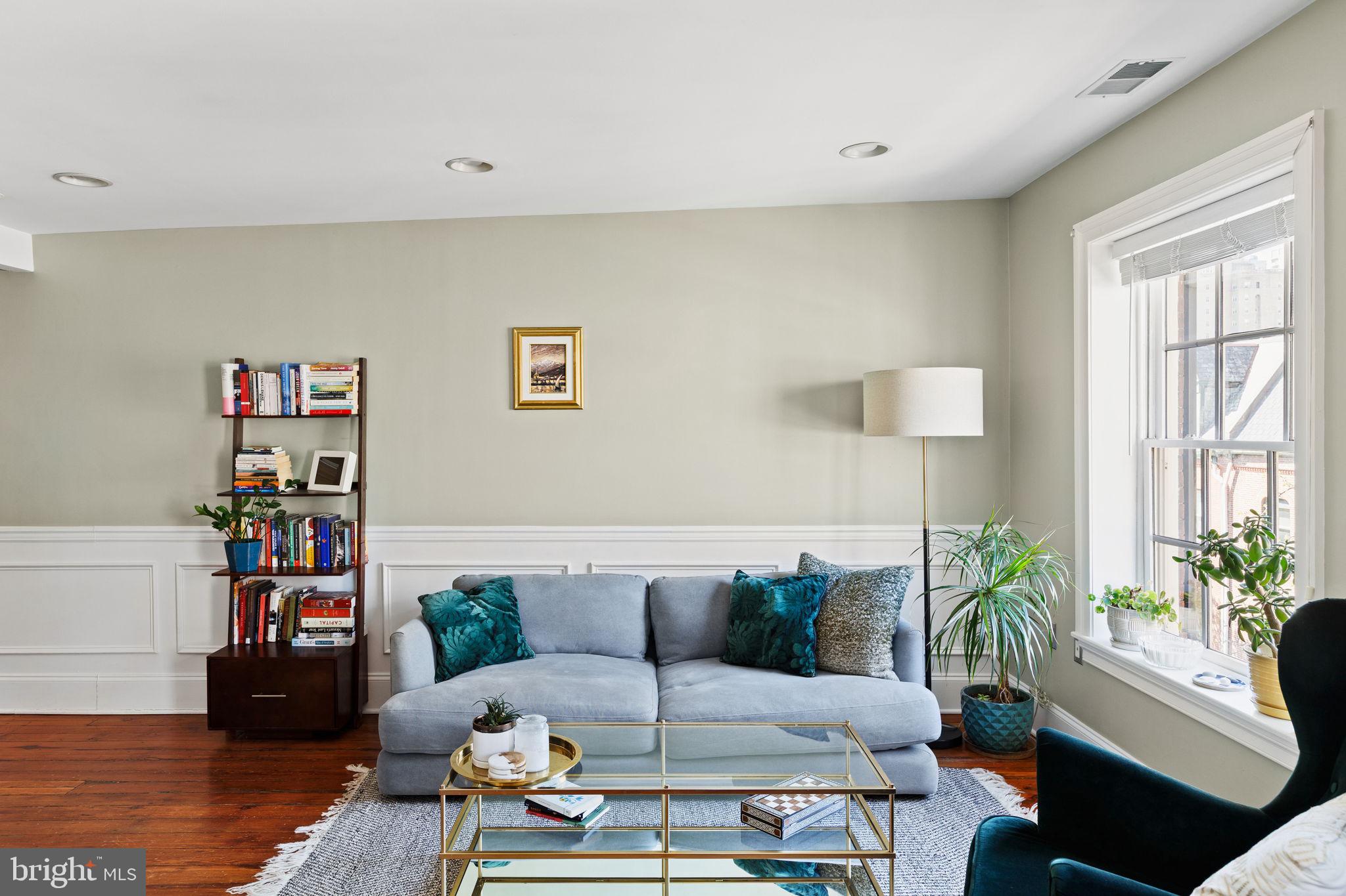 1708 Pine Street, Unit 4F Philadelphia, PA 19103 - Photo 2 of 16 a living room with furniture and a potted plant
