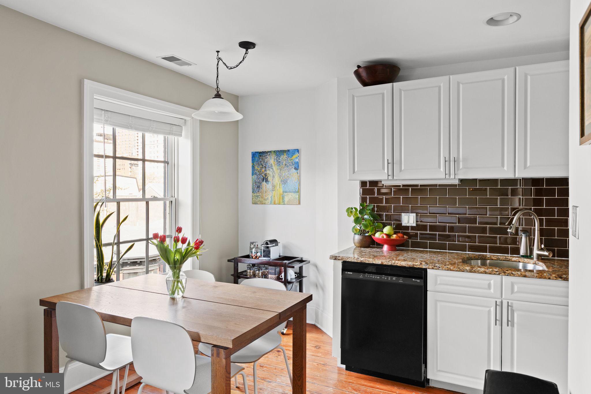 1708 Pine Street, Unit 4F Philadelphia, PA 19103 - Photo 5 of 16 a kitchen with stainless steel appliances a sink stove and white cabinets