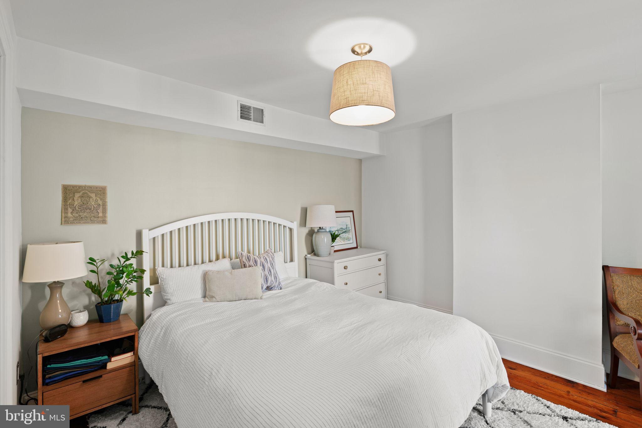 1708 Pine Street, Unit 4F Philadelphia, PA 19103 - Photo 10 of 16 a bedroom with a bed and a window