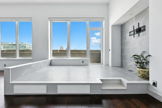 a living room with furniture and large window