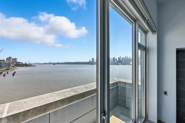 a view of a lake from a balcony