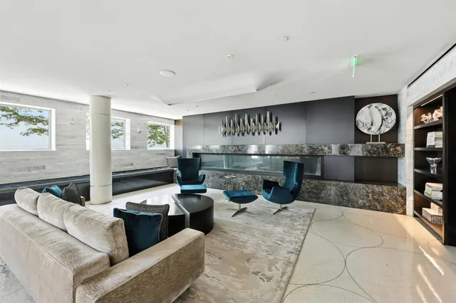 a view of a dining room with furniture and window