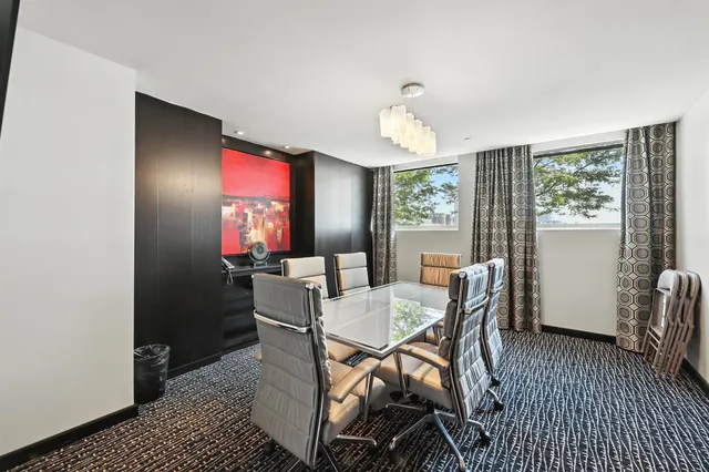 a view of a lake with outdoor seating