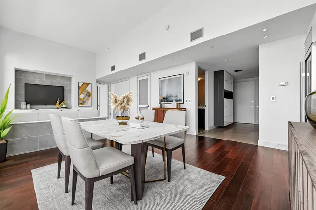 a view of a dining room with furniture and wooden floor