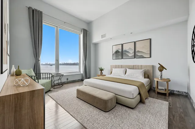 a spacious bedroom with a bed and window