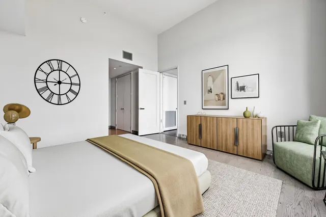 a bedroom with a bed and ceiling fan