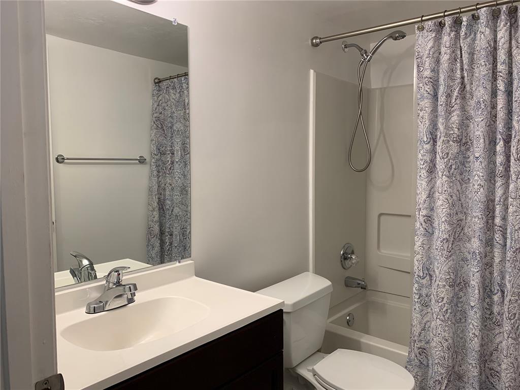 5754 Southwest 8th Place Gainesville, FL 32607 - Photo 23 of 29 a bathroom with a sink toilet and shower