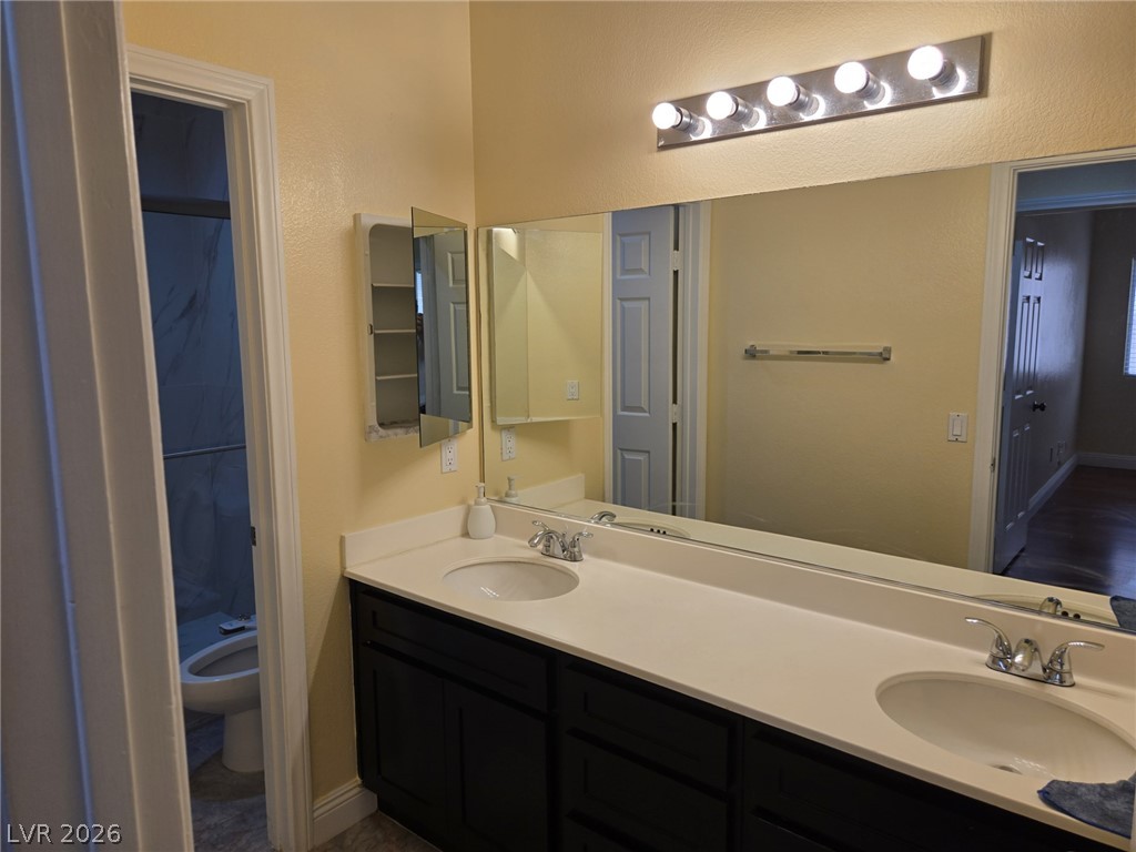8417 San Ramon Drive Las Vegas, NV 89147 - Photo 28 of 33 Double vanities with ample counter space create a functional and pleasant bathroom environment.