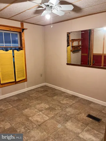 a view of an empty room with window