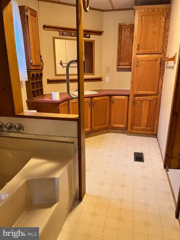 a kitchen with stainless steel appliances a refrigerator and cabinets