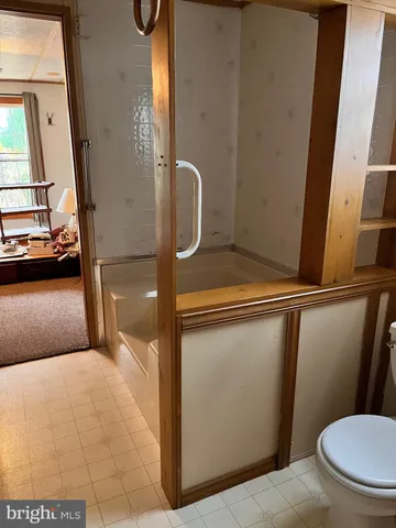 a bathroom with a toilet and a sink