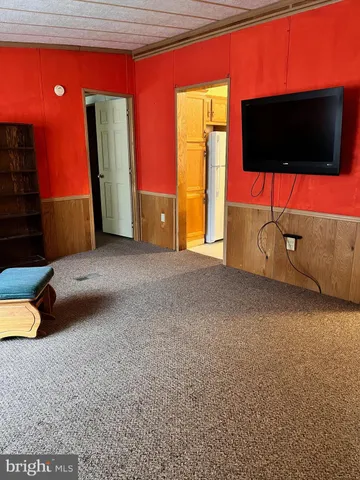 a view of a living room with a flat screen tv