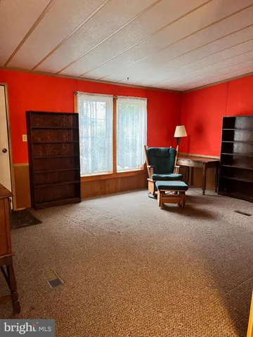 a room with furniture and a flat screen tv