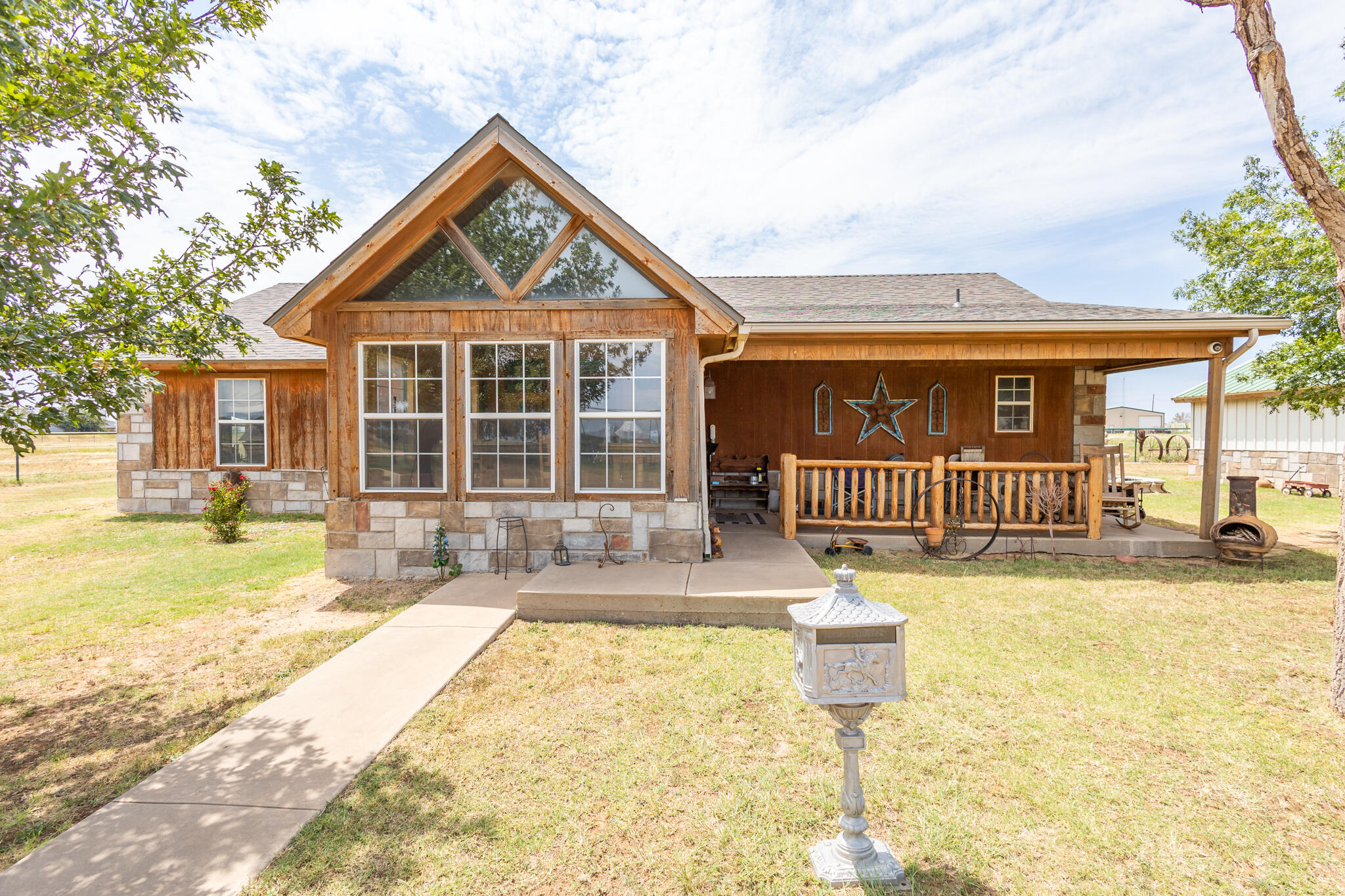3401 East Regis Street Lubbock, TX 79403 - Photo 1 of 65 a front view of a house with a yard table and chairs