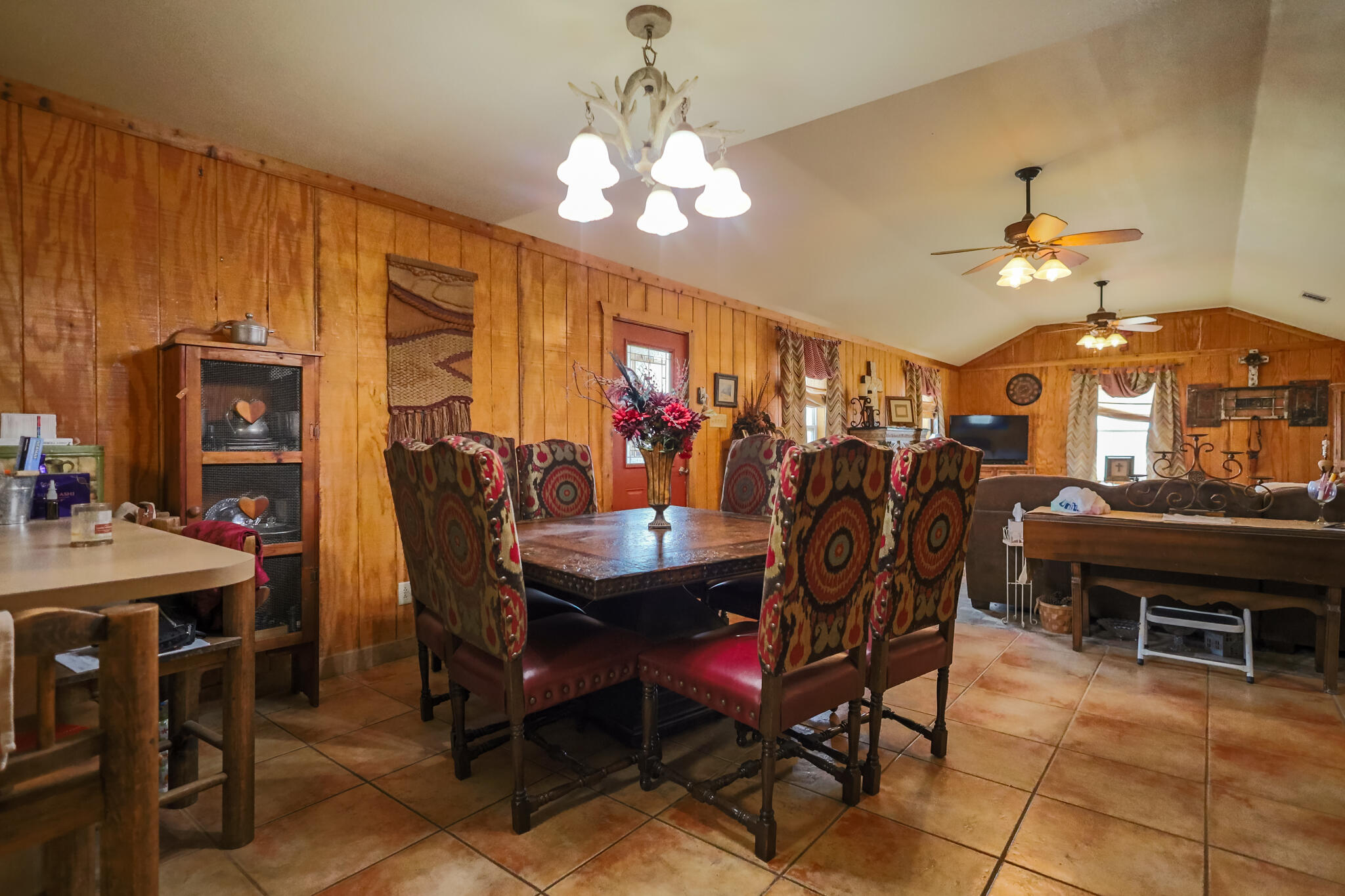 3401 East Regis Street Lubbock, TX 79403 - Photo 15 of 65 a view of a dining room with furniture and chandelier