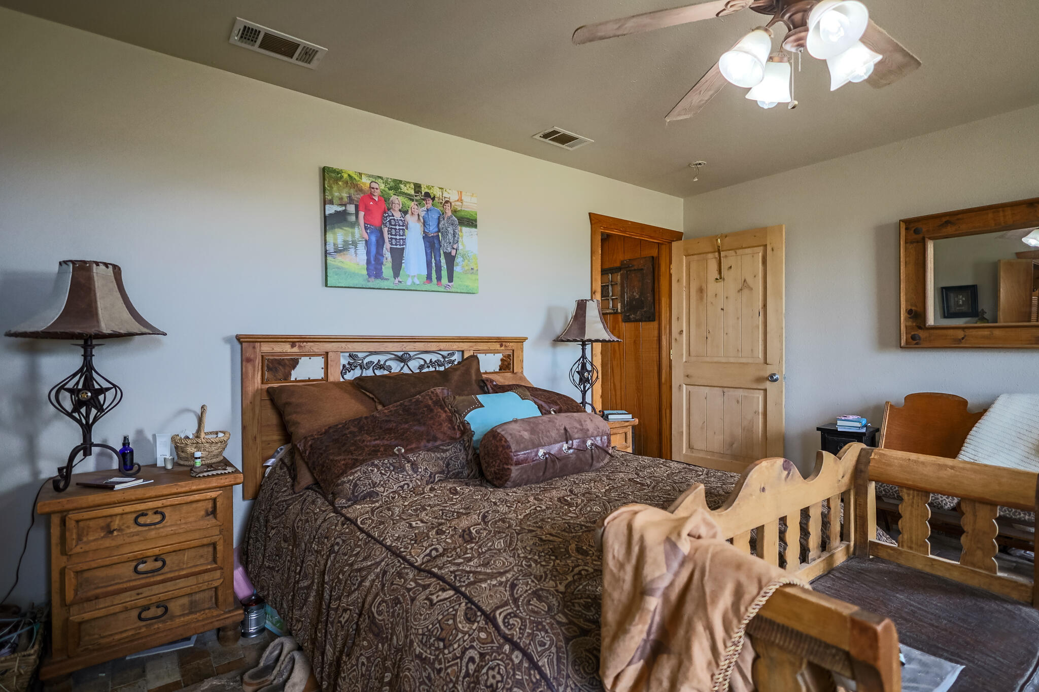3401 East Regis Street Lubbock, TX 79403 - Photo 20 of 65 a bedroom with a bed and wooden floor