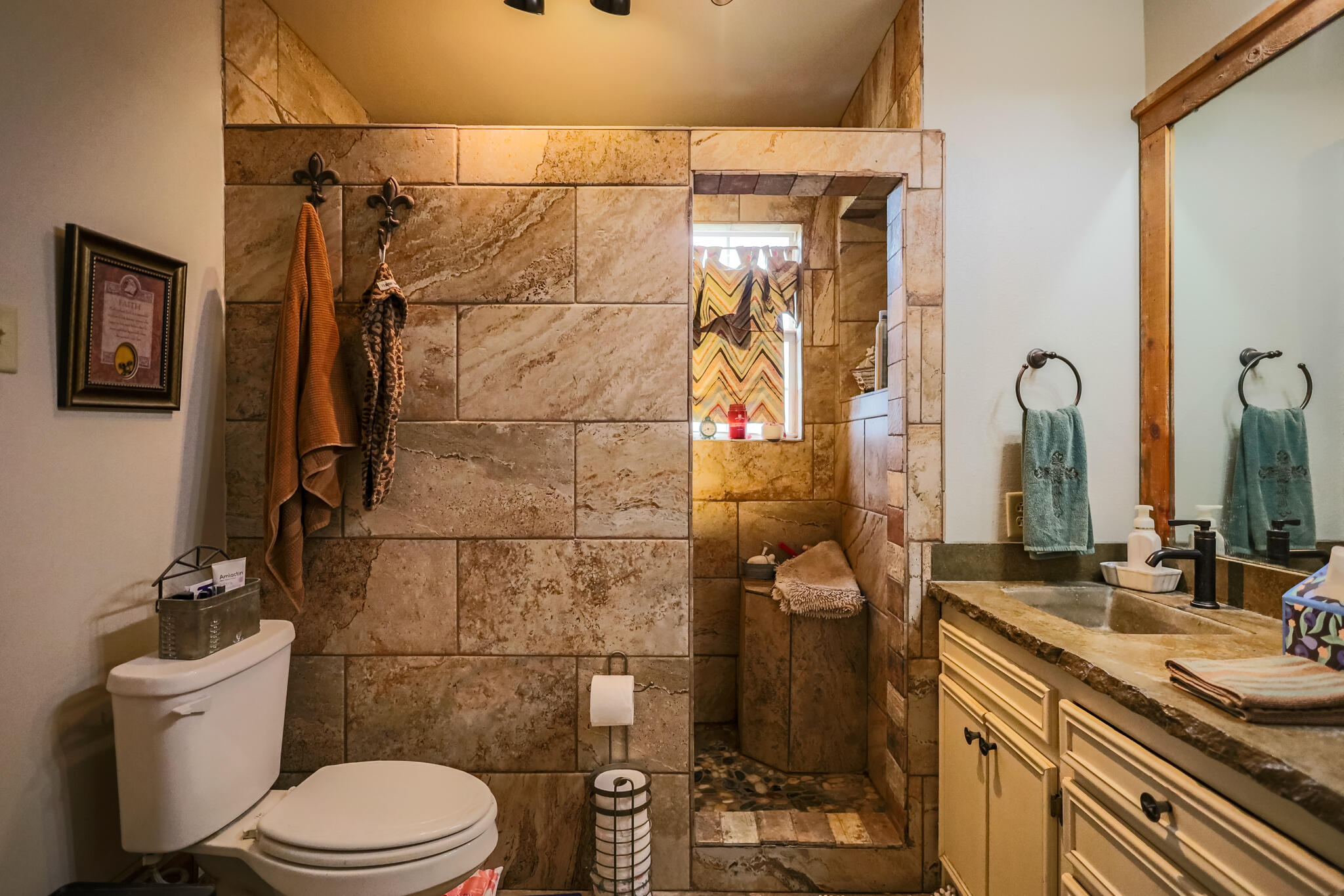 3401 East Regis Street Lubbock, TX 79403 - Photo 22 of 65 a bathroom with a granite countertop sink toilet and shower
