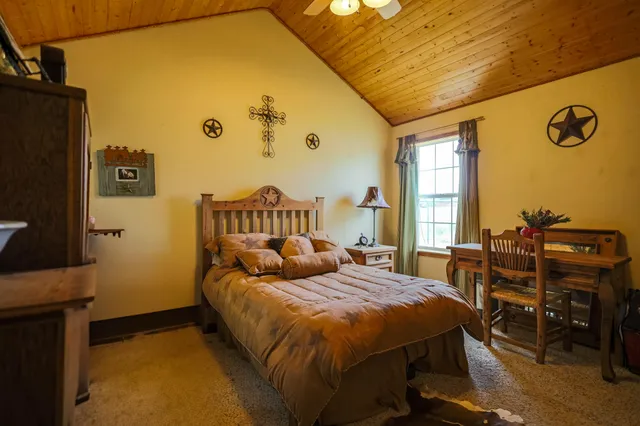 a bathroom with a double vanity sink toilet and shower