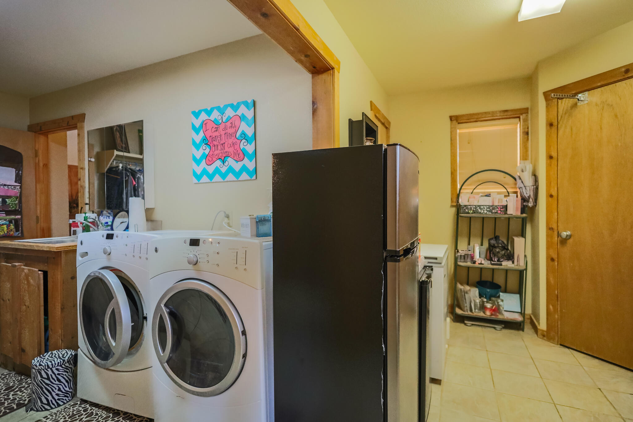 3401 East Regis Street Lubbock, TX 79403 - Photo 30 of 65 a utility room with dryer and washer