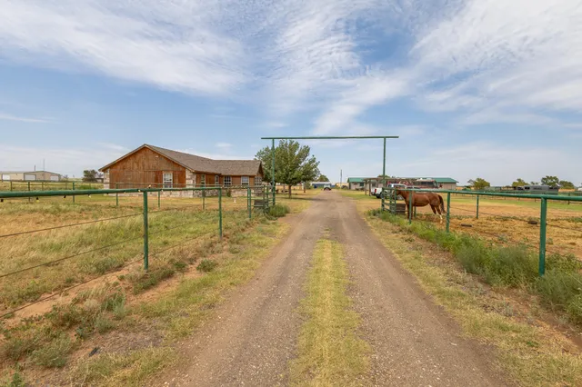 a view of a lake with a yard
