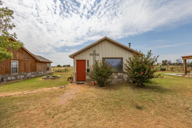 a view of a swimming pool with an outdoor seating space