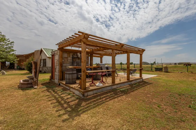 a view of swimming pool with a table and chairs
