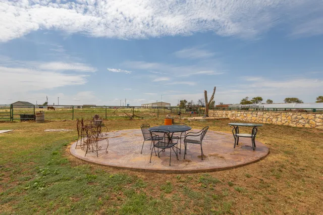 a view of a room with gym equipment and a large window