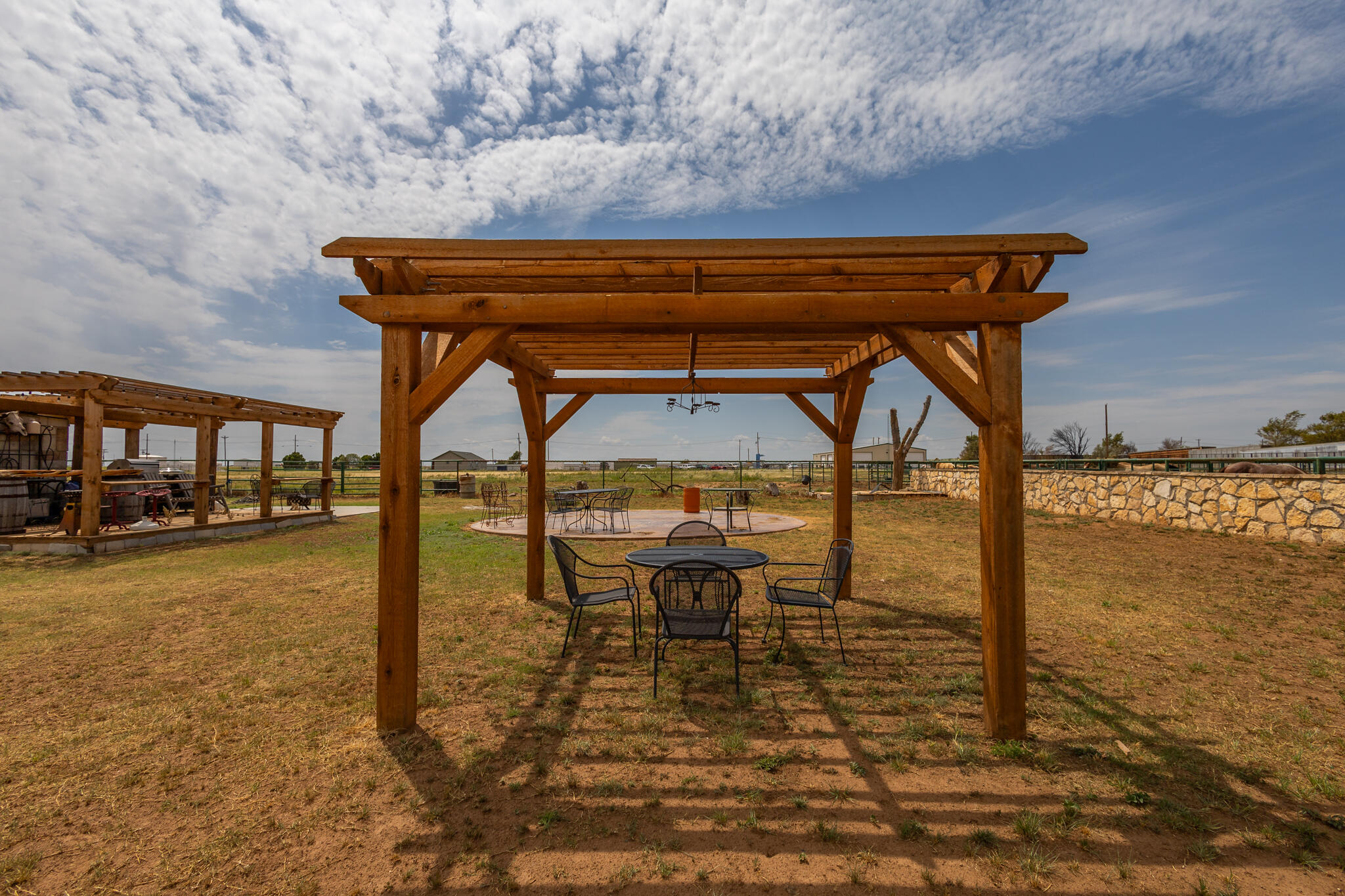 3401 East Regis Street Lubbock, TX 79403 - Photo 40 of 65 a view of swimming pool with a table and chairs