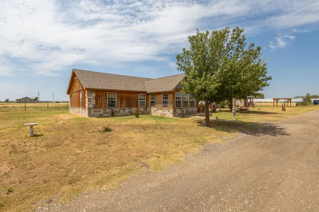 a view of a house with backyard space