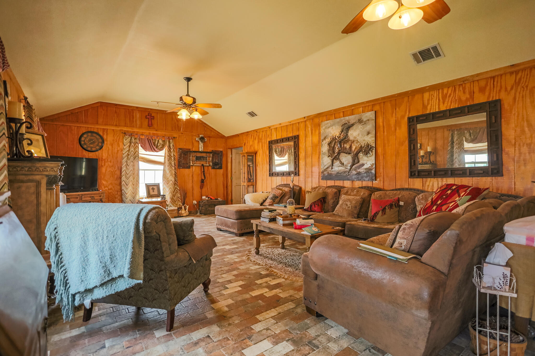3401 East Regis Street Lubbock, TX 79403 - Photo 10 of 65 a living room with furniture a chandelier and a window