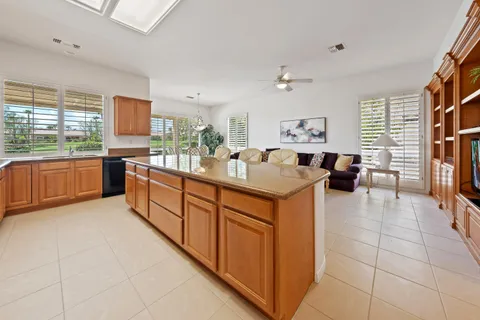 a kitchen with stainless steel appliances granite countertop a sink and cabinets