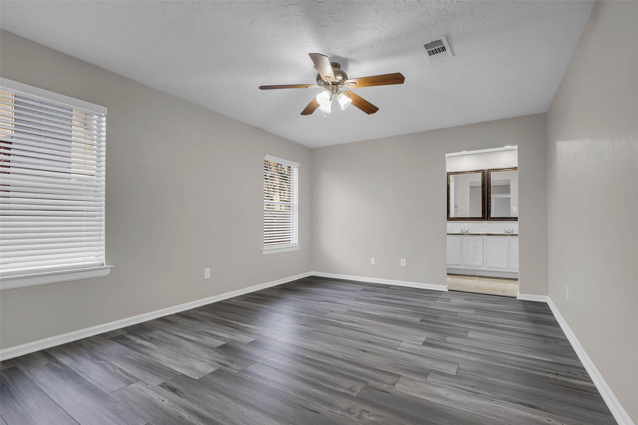 8 Still Glen Court Spring, TX 77381 - Photo 13 of 23 wooden floor in an empty room with a window