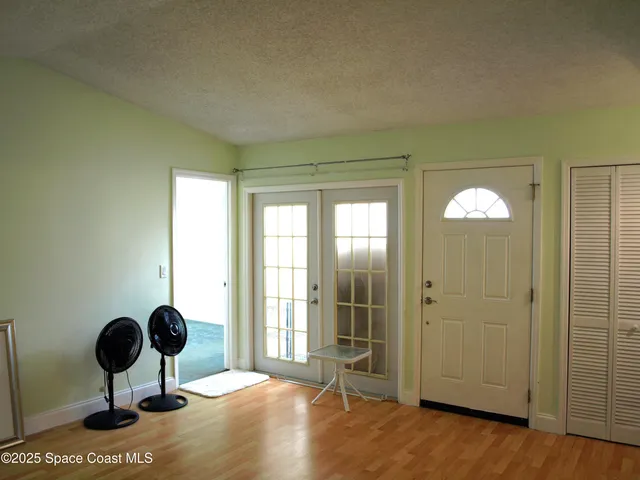 a view of livingroom with furniture wooden floor and windows
