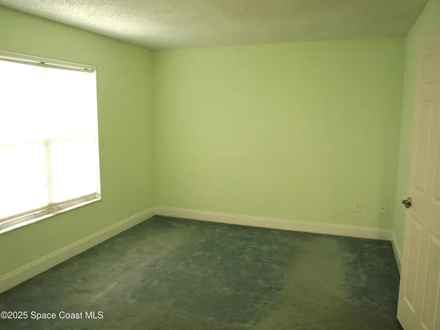 a view of a room that has a window