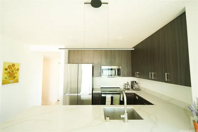 a kitchen with a refrigerator and a sink