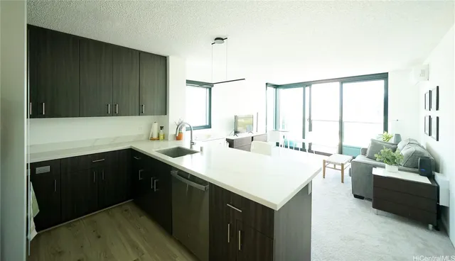 a kitchen with a sink and a refrigerator