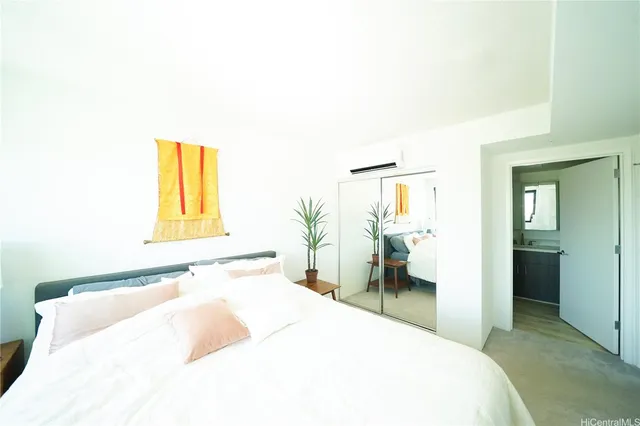 a bedroom with a bed and a couch