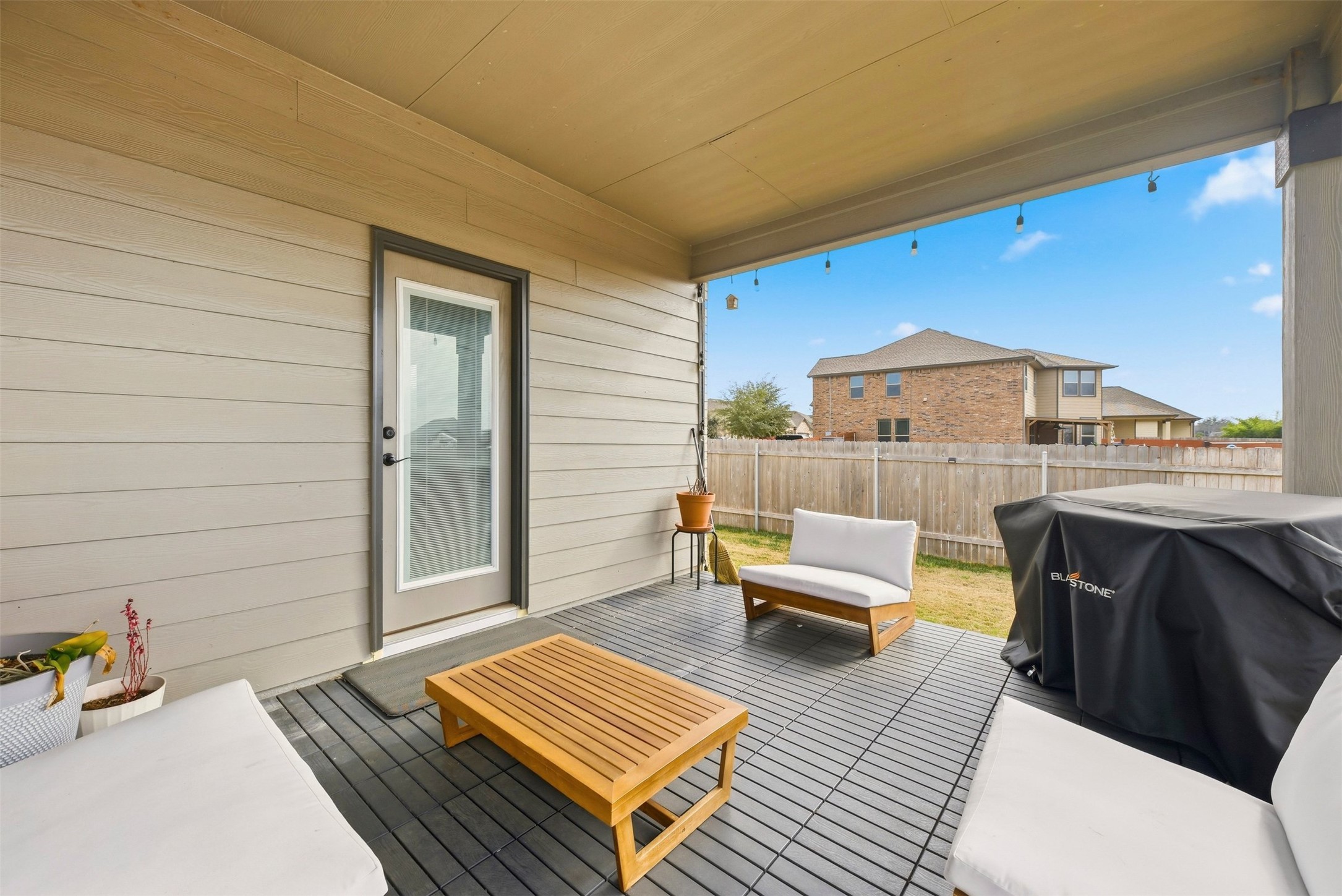 1506 Dragonfly Loop Bastrop, TX 78602 - Photo 26 of 28 Deck featuring a patio area, an outdoor living space, and area for grilling