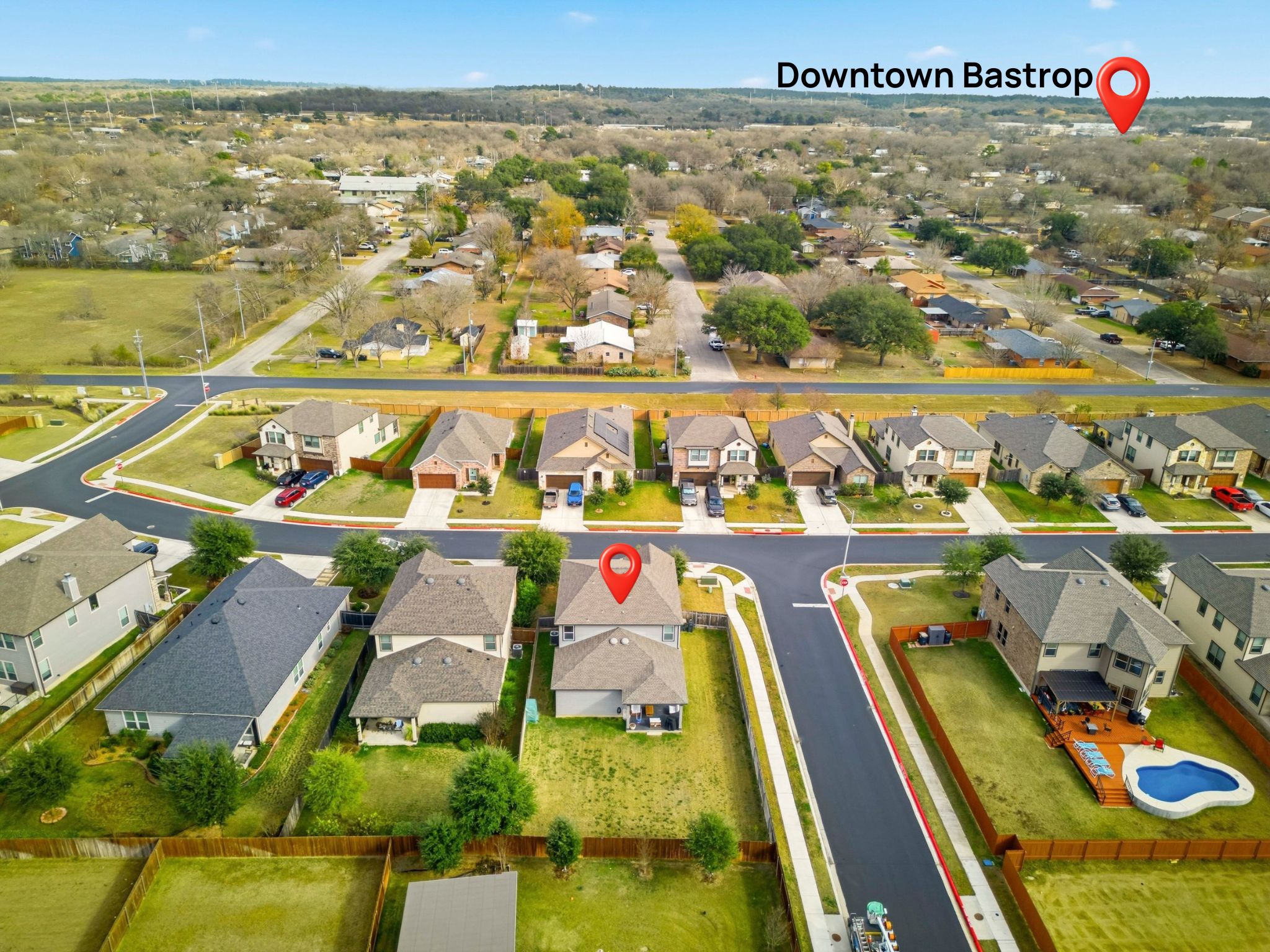 1506 Dragonfly Loop Bastrop, TX 78602 - Photo 27 of 28 Aerial perspective of suburban area